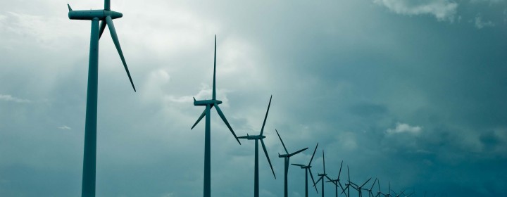 Windmills in a row on cloudy weather, wide shot, denmark